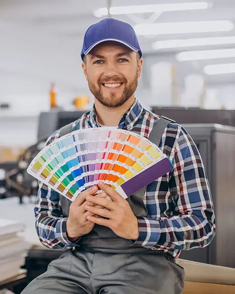 S2 a person holding a fan of color swatches